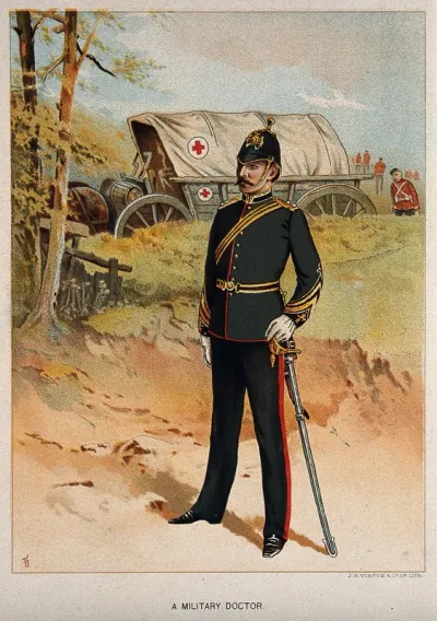 A uniformed British military doctor in front of a Red Cross horse-drawn cart