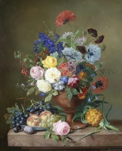 A vase of mixed flowers and fruit on a marble ledge