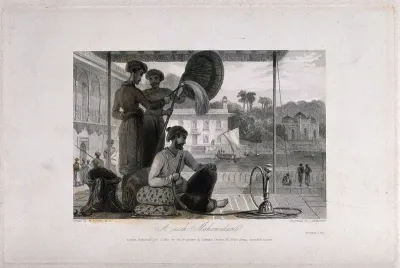 A wealthy Mohammedan smoking a hooka as two attendants fan him