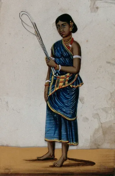 A whip sellers's wife holding some whips