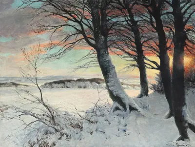A winter landscape at sunset.