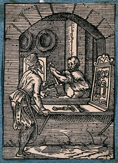 A wire-drawer working at his bench