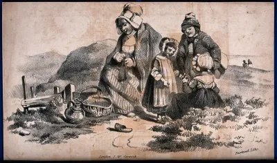 A woman and three chidren are sitting by the side of a track with a basket and flagon nearby