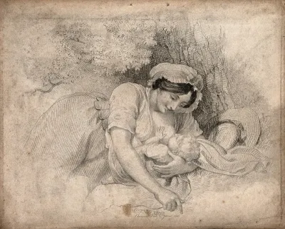 A woman breast feeding her child