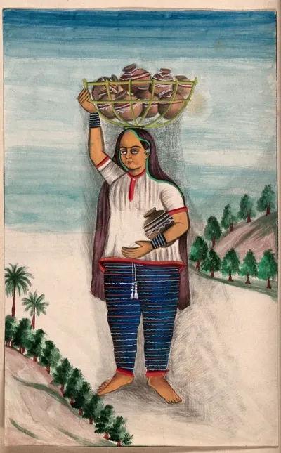 A woman carries a basket of decorated earthern pots on her head
