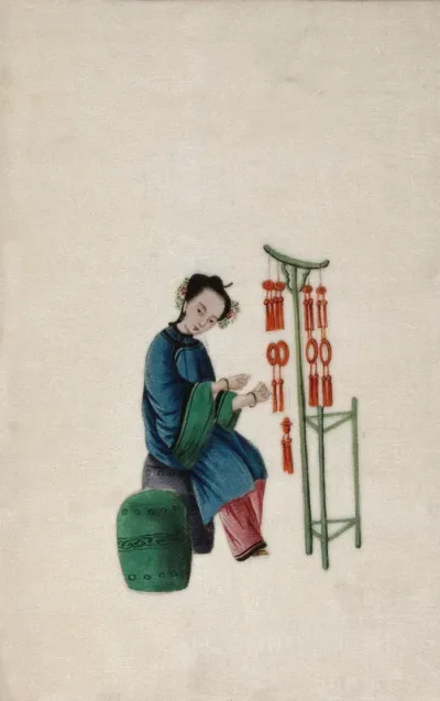 A woman displaying good luck tassels for sale
