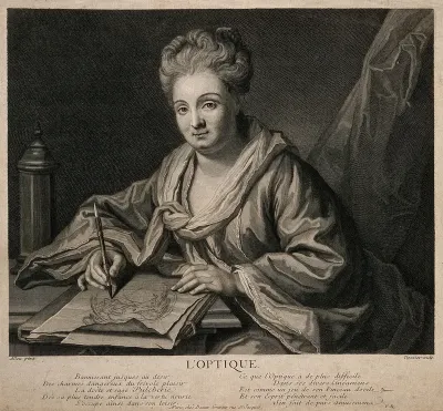 A woman drawing at a desk; representing optics