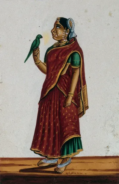 A woman from Maharashtra, with a bird perched on her hand