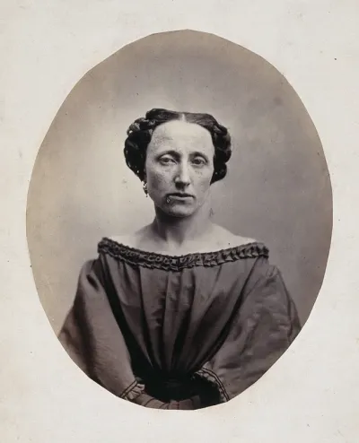 A woman, head and shoulders, viewed from the front