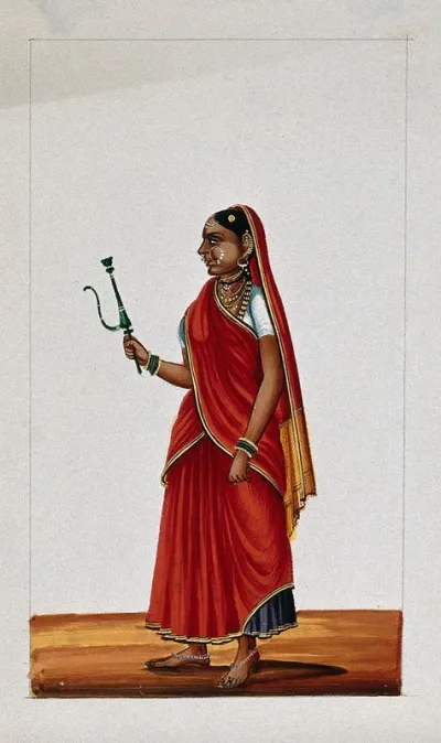 A woman holding a samll hookah (smoking pipe)