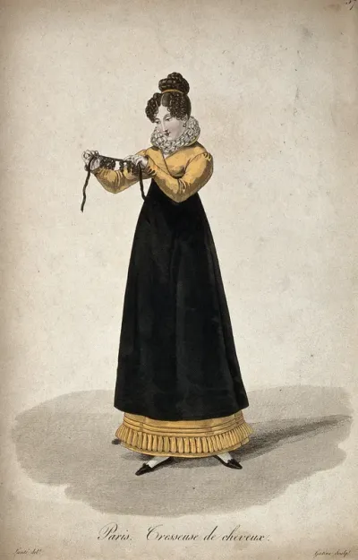 A woman holding out a ribbon with ringletted hair-pieces attached to it