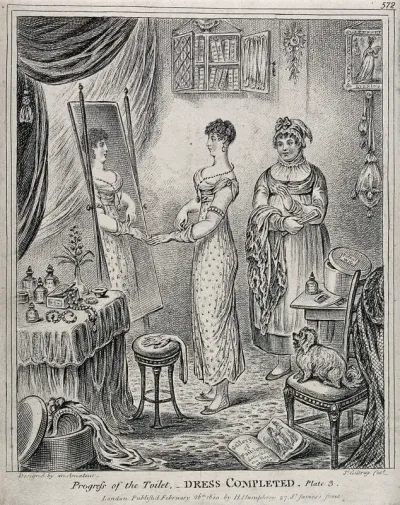A woman in evening dress standing in front of a mirror; to the left a maidservant holds her fan and shawl
