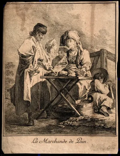 A woman in Russia is sitting at a table selling bread to an Albanian soldier wearing a long cloak; a child is curled up asleep on the ground