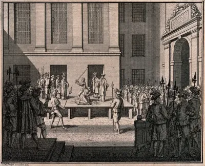 A woman is beheaded on a wooden stage in a courtyard with a crowd of soldiers carrying halberds looking on