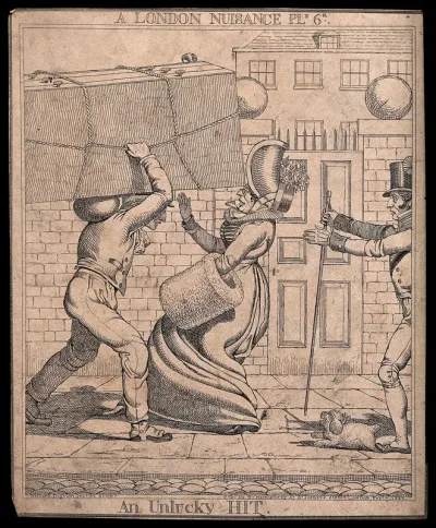 A woman is nearly knocked over by a man carrying a large item on his head