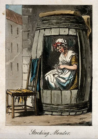 A woman is sitting in a large barrel mending stockings