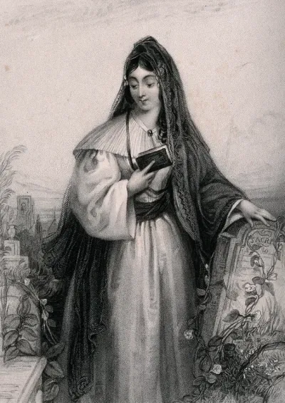 A woman leaning on a tombstone in a graveyard reading from her bible