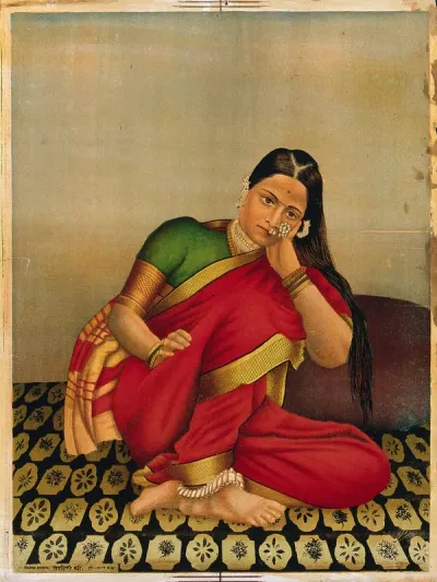 A woman leaning wistfully on a large cushion