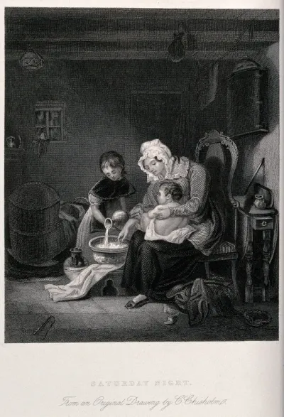 A woman prepares to bathe a baby aided by an older girl who pours water into a bowl