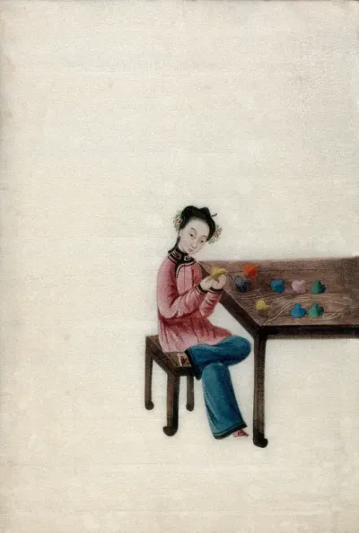 A woman preparing coloured silk thread (?)