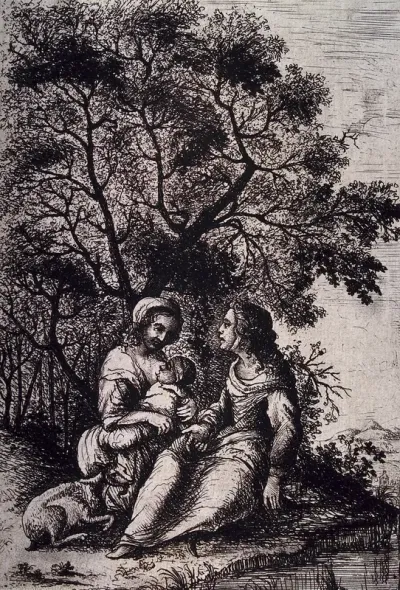 A woman sitting outside with a friend breast-feeding her child, a goat accompanies them