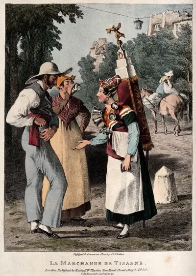A woman tea vendor is waiting for payment for the drink the man has bought for his female companion