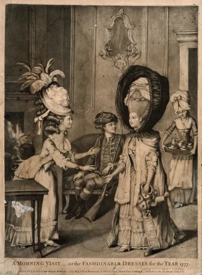 A woman wearing a high wig and protective hood entering into a breakfast parlour and being greeted by another woman wearing an elaborate wig and hat with feathers attached to the back of it; in the background a seated man looks on and a maid-servant 