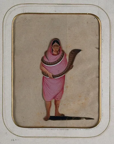 A woman wearing a pink saree with a snake wrapped around her body