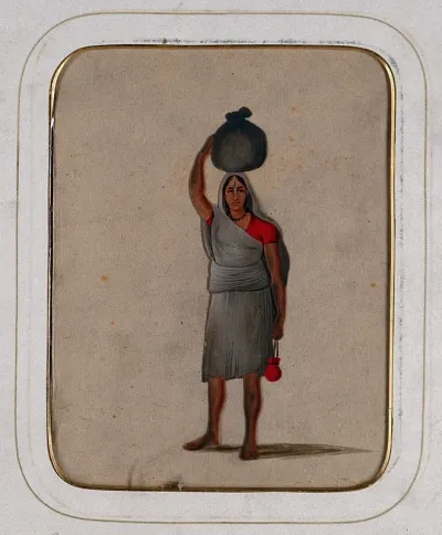 A woman with a Vishnu mark on her forehead, carrying a cloth bundle on her head