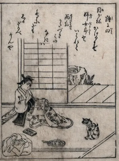 A woman writing with a calligraphy brush