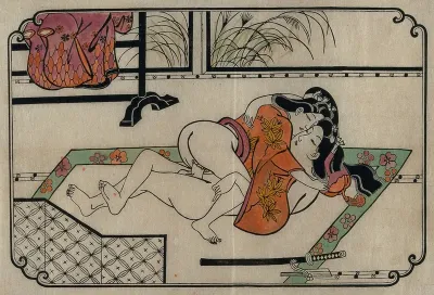 A young couple making love, woman above