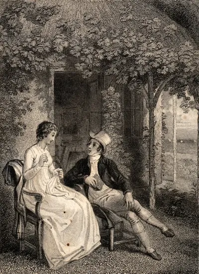 A young couple sit talking in a garden