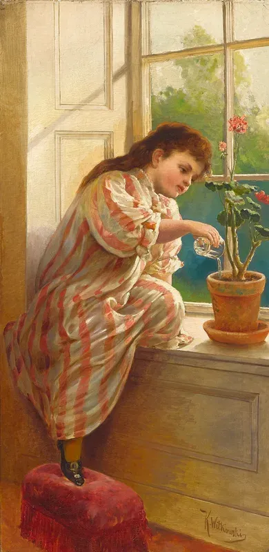 A young girl watering a geranium