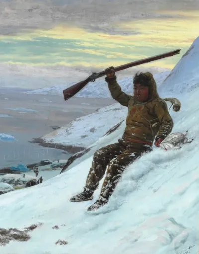 A young Greenlandic grouse hunter is sliding down the mountain