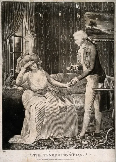 A young male physician holding the hand of a female patient, a squirrel is seated next to her chewing