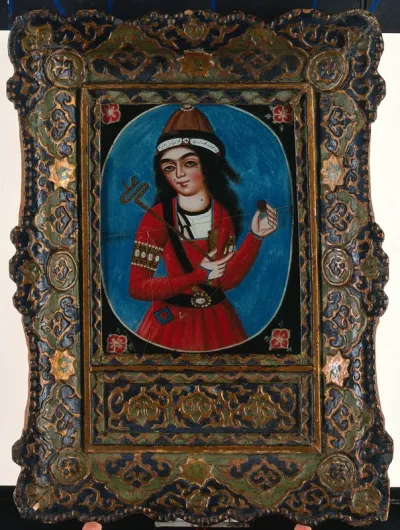 A young man holding a rod with a shaped end (sceptre?) and a round object
