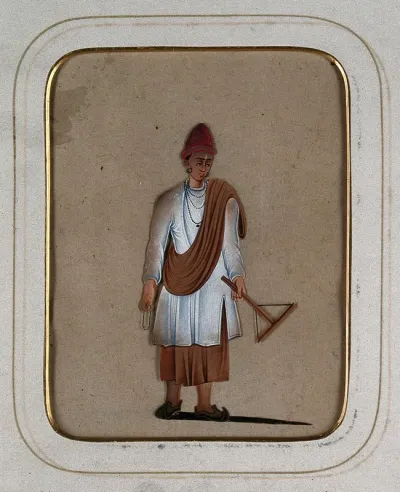 A young man holding rosary beads in one hand and a tool of his trade in the other
