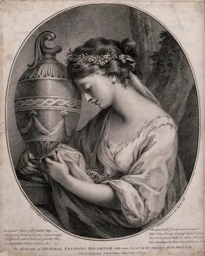 A young woman grieving and embracing an urn