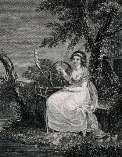 A young woman is using a spinning wheel under a tree with a spindle and shuttle