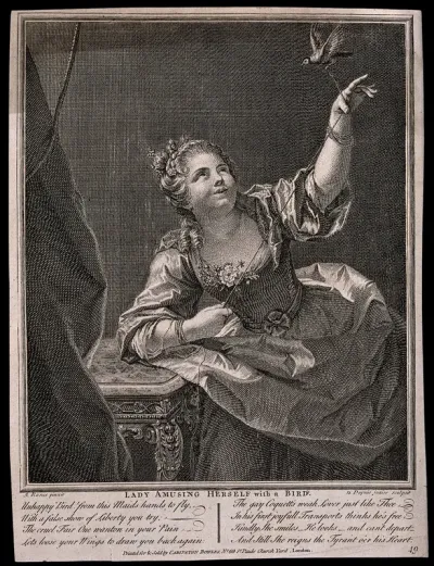 A young woman playing with a bird, which she has on a string