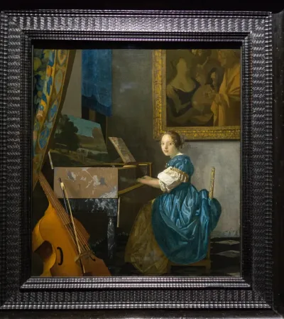 A Young Woman seated at a Virginal