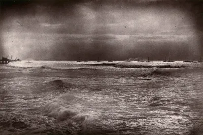 Algoa Bay, South Africa: a bay with pier and boats in a gale