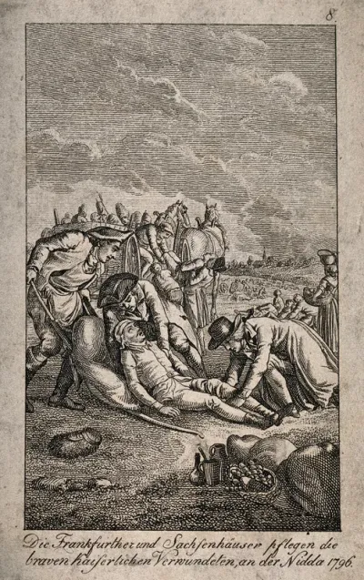 Ambulancemen picking up the wounded from a battlefield