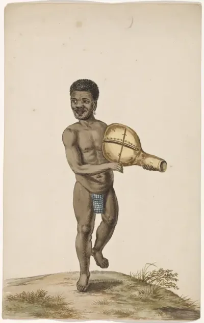 An African Man Making Music with a Gourd Instrument