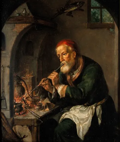 An alchemist blowing on a fire to heat a still (?)