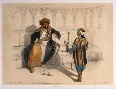 An Arab sheikh smoking a hooka attended by his pipe-bearer
