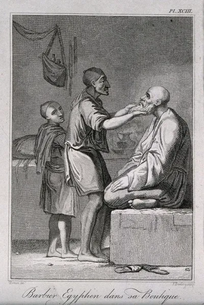 An Egyptian barber shaving a man in his shop; a boy assistant looks on