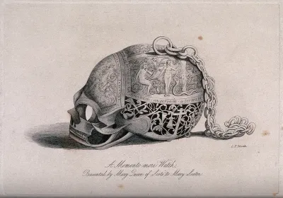 An elaborately decorated skull containing a watch and a chain