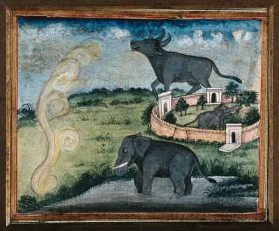 An elephant standing in the water, a large bull in the background and an elephant inside a walled area