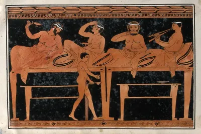 An episode on a Greek red-figured wine-mixing bowl (bell-krater): four reclining symposiasts are served by a boy holding a wine-jug and a strainer